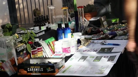 Guy talking to customer about his cannabis products Stock Footage 154561900