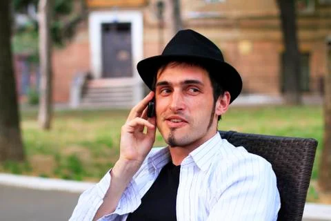Guy is talking on a mobile phone   Stock Photos
