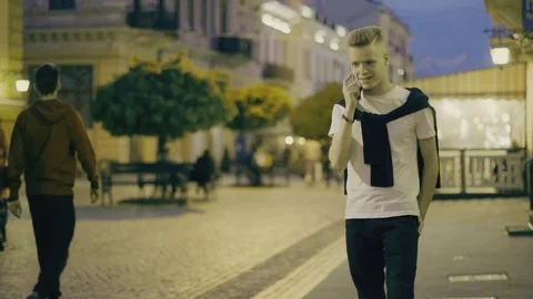 The guy is talking on the phone Stock Footage 75608426