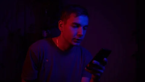 The guy is talking on the smartphone to the front camera Stock Footage 122237315