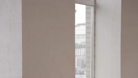 The guy talks in a fire uniform over the phone. In a buiding. 動画素材 130222457