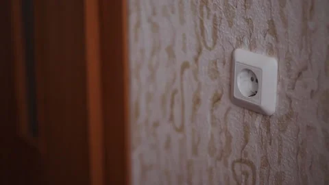 Guy tee inserts into the socket Stock Footage 137295674