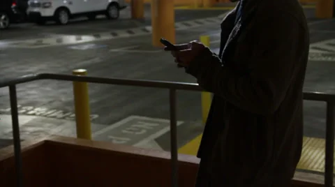 A guy texting in his phone while walking Stock Footage 36173546