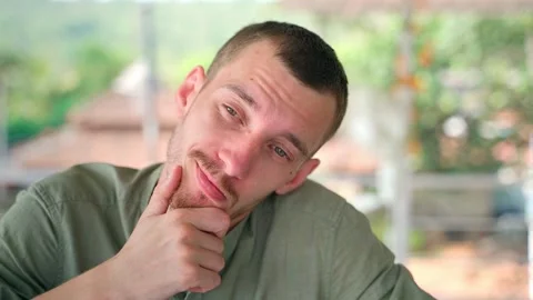 The guy is thinking about something with passion and interest. Stock Footage 231336742