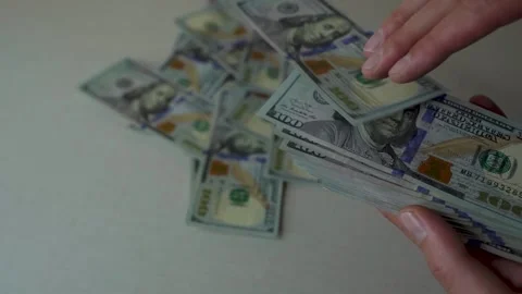 Guy throwing money around, dollar bills, investments and profits, close-up Stock Footage 220477226