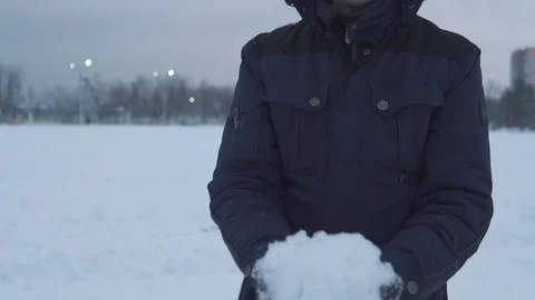 The guy throws snow over himself Stock Footage 83709743