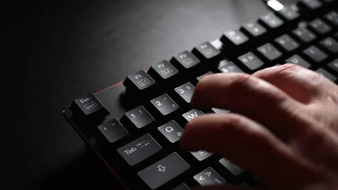 Guy tiping in front of a bright computer screen, 4k 60fps Stock Footage 140594638