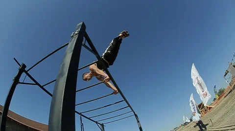 Guy trains exercise of street workout on the beach Video stock 59438358