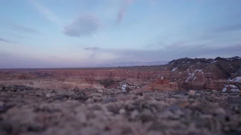 A guy in trekking boots takes steps through Canyon Stock Footage 237078800
