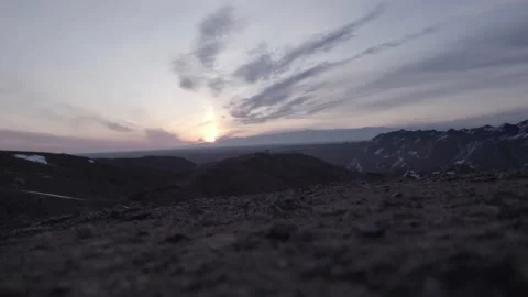 A guy in trekking boots takes steps through Canyon Stock Footage 237741377