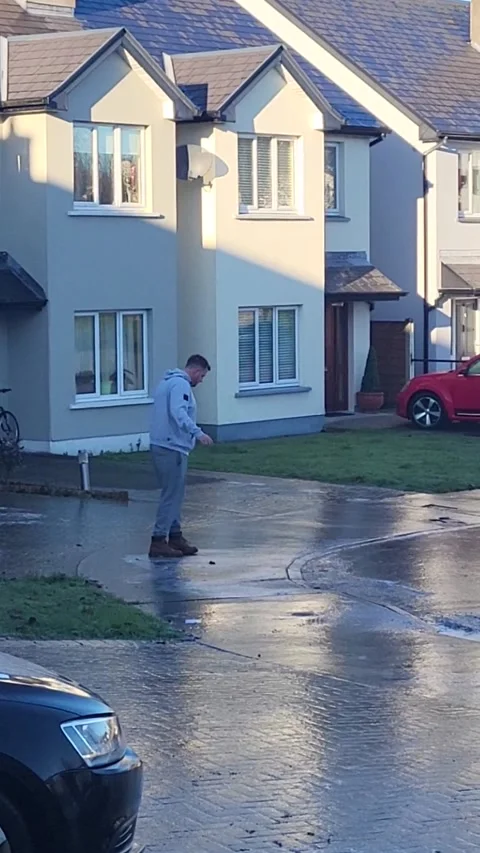 Guy Tries Getting to Work After Storm Creates Icy Parking Lot, Charlestown, Irel Stock Footage 225778086