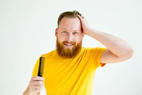 Guy trimming his beard Stock Photos