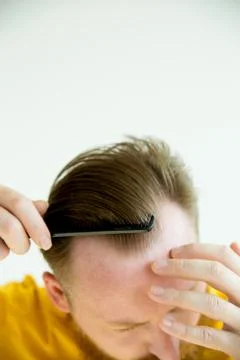 Guy trimming his beard Stock Photos