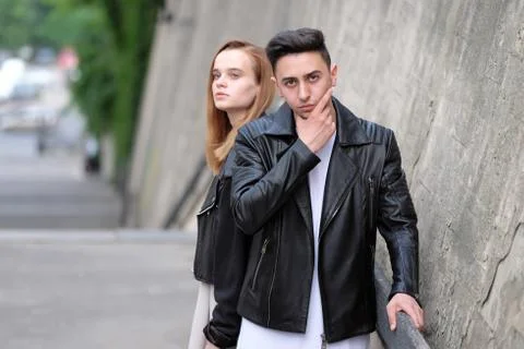 The guy turned his back on his girlfriend with red hair, angry Stock Photos