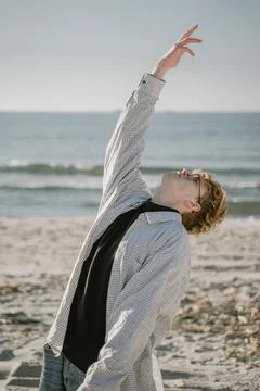 The guy turns to heaven, pulls his hand into the sky Stock Photos