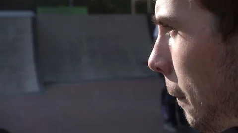 Guy turns his head and looks at the cyclists 스톡 동영상 103650174