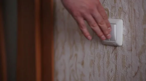 Guy turns on the light and go into another room Stock Footage 48932163
