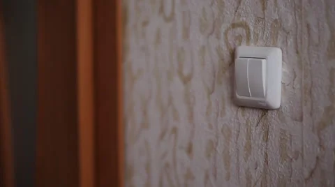 Guy turns on the light Stock Footage 48932170