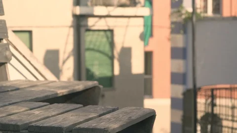 Guy tying his shoe on a bench  Stock Footage 88141980