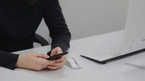 The guy type a message on his phone Stock Footage 106498557