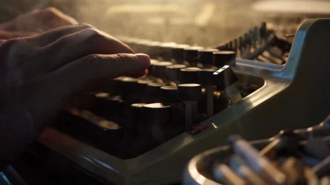 Guy types on an old typewriter and smokes cigarettes, writer, journalist Stock Footage 138812937