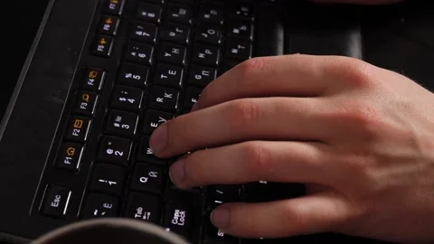 The guy is typing on a black keyboard. Computer work. Stock Footage 219565186