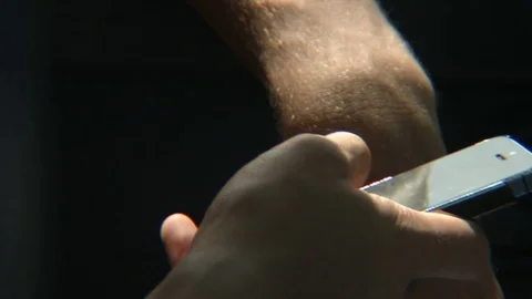 Guy typing on phone Stock Footage 77629967