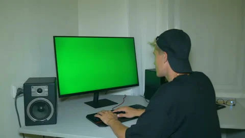 Guy is typing text on the keyboard. Chromakey on computer screen. Stock Footage 204947222