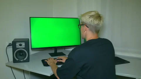 Guy is typing text on the keyboard. Chromakey on computer screen. Stock Footage 204947249