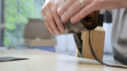 Guy unfolds a set of tools for working with the skin Stock Footage 80098978