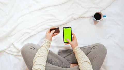 Guy use app on mobile for payment at home Stock Footage 116527563