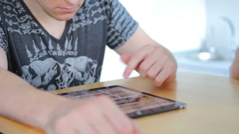 Guy uses his tablet for shopping Stock Footage 101737559