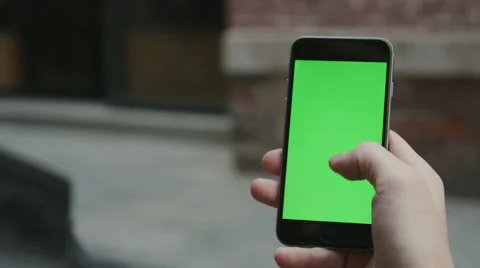 Guy Using a Green Screen iphone Video stock 59775925