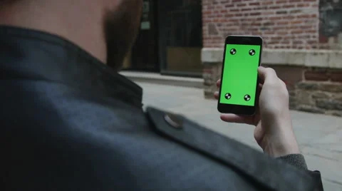 Guy Using green screen iphone Video stock 59776310