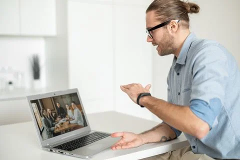 A guy is using laptop for video call Stock Photos
