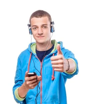 Guy using phone with headphones Stock Photos