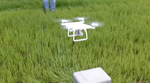 Guy using remote control to film aerial video with drone mounted camera, robot Stock Footage 64077674