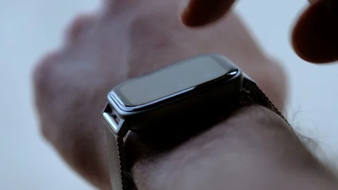 Guy using smart watch to check notification,hi tech connectivity device,clock Stock Footage 129525163
