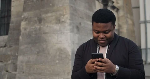 Guy using smartphone and tapping forehead. Stock Footage 121214776