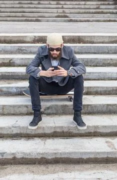 Guy using wireless fidelity in the city. Stock Photos