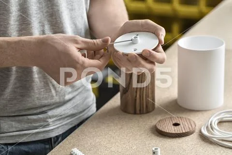 Guy using wrench in workshop Stock Photos