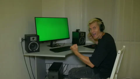 Guy is very happy with what is shown on the computer screen. Stock Footage 204946858