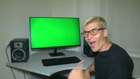 Guy is very happy with what is shown on the computer screen. Stock Footage 204946937