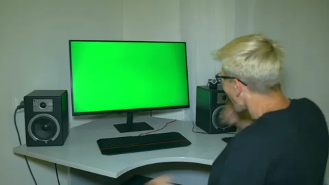 Guy is very happy with what is shown on the computer screen. Stock Footage 204947145