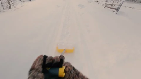 The guy very quickly clears the snow on the forest path with a shovel. Stock Footage 327144987