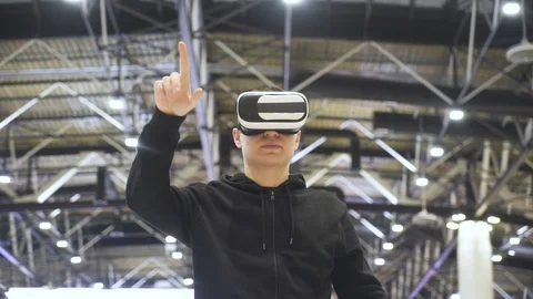 Guy in virtual glasses at the airport Stock Footage 127458345
