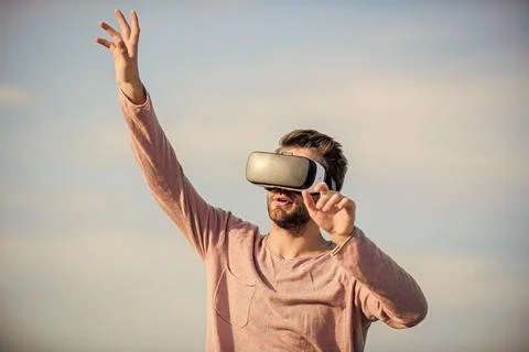 Guy virtual reality goggles. Using VR technologies. Digital future and Stock Photos