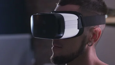 Guy in virtual reality headset testing new app. Close-up of face. Space travel Stock Footage 98180451