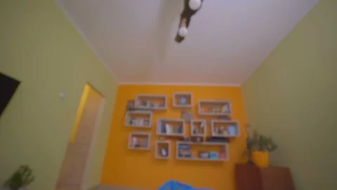 The guy wakes up on an alarm clock at 7 in the morning and put on slippers Stock-Footage 129404945