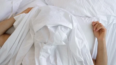 Guy waking in bed Stock Footage 89463801